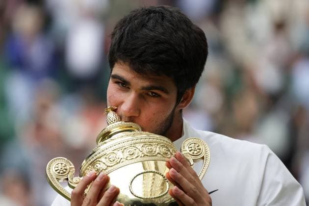 16th July 2023; All England Lawn Tennis and Croquet Club, London, England: Wimbledon Tennis Tournament; Mens singles final on centre court Novak Djokovic versus Carlos Alcaraz; Carlos Alcaraz lifts the winners trophy after beating Djokovic in 5 sets  ActionPlus12532121 JohnxPatrickxFletcher