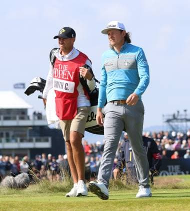 Last year s Open winner Australian Cameron Smith walks with his caddie on the second fairway on the first day at the 151st Open Championship at the Royal Liverpool Golf Club in Hoylake England on Thursday, July 20, 2023.  LON2023072015 HUGOxPHILPOTT