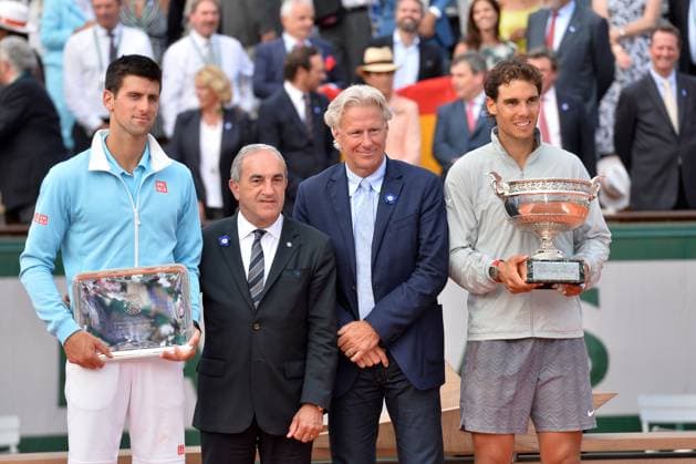 Roland Garros - Rafael Nadal Wins Title - Paris Rafael Nadal of Spain is presented with the Coupe des Mousquetaires by Bjorn Borg after his men s singles final match against Novak Djokovic of Serbia on day fifteen of the French Open at Roland Garros on June 8, 2014 in Paris, France. Photo by Laurent Zabulon ABACAPRESS.COM Paris France  Copyright: xZabulonxLaurent ABACAx 451560_057 ZabulonxLaurent ABACAx 451560_057