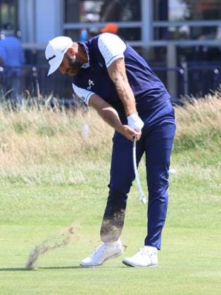 American Dustin Johnson plays a fairway iron on the first day at the 151st Open Championship at Royal Liverpool Golf Club in Hoylake, England on Thursday, July 20, 2023.  LON2023072035 HUGOxPHILPOTT