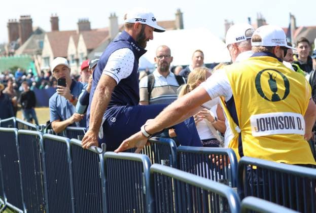 Sport Bilder des Tages American Dustin Johnson climbs over the railings after a mishit from the 1st tee on the first day at the 151st Open Championship at Royal Liverpool Golf Club in Hoylake, England on Thursday, July 20, 2023.  LON2023072041 HUGOxPHILPOTT