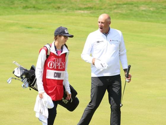 American Stuart Cink laughs with his caddy hand on the 18th green on the first day at the 151st Open Championship at Royal Liverpool Golf Club in Hoylake, England on Thursday, July 20, 2023.  LON20230720121 HUGOxPHILPOTT