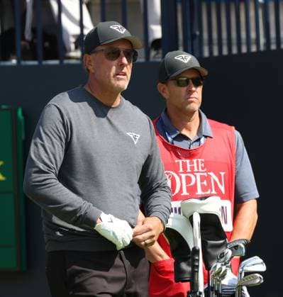 American Phil Mickelson and his caddie on the 1st tee on the first day at the 151st Open Championship at Royal Liverpool Golf Club in Hoylake, England on Thursday, July 20, 2023.  LON2023072092f HUGOxPHILPOTT