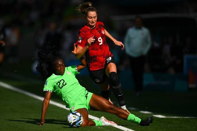 WWC23 CANADA NIGERIA, Jordyn Huitema of Canada (top) is tackled by Michelle Alozie of Nigeria during the FIFA Women s World Cup 2023 soccer match between Nigeria and Canada at Melbourne Rectangular Stadium in Melbourne, Friday, July 21, 2023. ( NO ARCHIVING, EDITORIAL USE ONLY, NO USE IN BOOKS WITHOUT CONSENT MELBOURNE VICTORIA AUSTRALIA  Copyright: xMORGANxHANCOCKx 20230721001822518142 