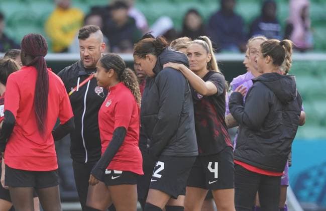 July 21, 2023, Melbourne, Australia: Canada s Christine Sinclair (12) is consoled by Shelina Zadorsky (4) as the players leave the field following a 0-0 draw against Nigeria in Group B soccer action at the FIFA Women s World Cup in Melbourne, Australia, Friday, July 21, 2023. Canada News - July 21, 2023  - ZUMAc35_ 20230721_zaf_c35_018 Copyright: xScottxBarbourx