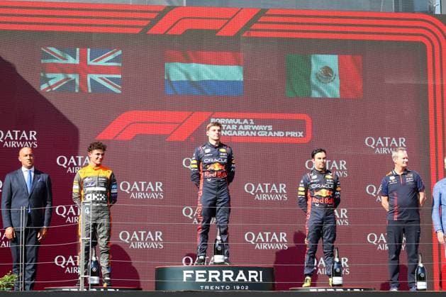 Podium: from left to right Lando Norris (GBR) McLaren MCL60 Max Verstappen (NED) Redbull Racing RB19 Paul Monegan (GBR) Technical Director Oracle Red Bull Racing Sergio Perez (MEX) Redbull Racing RB19 during Podium Celebration after the race, Sunday Jul 23th FORMULA 1 QATAR AIRWAYS HUNGARIAN GRAND PRIX 2023 - Jul21 to Jul23 2023 Hungaroring, Budapest, Hungary during 2023 Formula 1 Qatar Airways Hungarian Grand Prix, Formula One World Championship, WM, Weltmeisterschaft - Race, Formula 1 Championship in Mogyorod, Hungary, July 23 2023  Copyright: xAlessioxDexMarco IPAxSportx xipax xx 0 IPA_IPA39369149