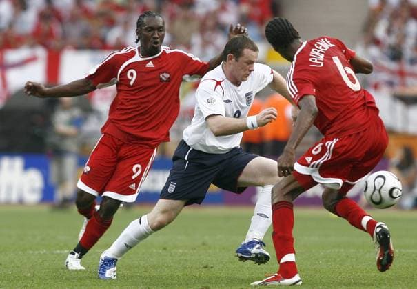 World Cup 2006 - England vs Trinidad and Tobago Trinidad and Tobago s Aurtis Whitley, England s Wayne Rooney and Trinidad and Tobago s Dennis Lawrence during the World Cup 2006, England vs Trinidad and Tobago at the Easy-Credit-Stadion stadium in Nuremberg, Germany on 15, 2006. England won 2-0. Photo by Christian Liewig ABACAPRESS.COM Nuremberg Germany  Copyright: xLiewigxChristian ABACAx 100080_03 LiewigxChristian ABACAx 100080_03
