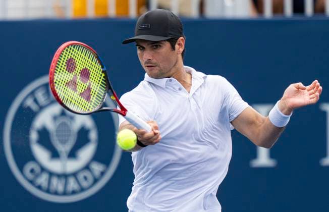 (230807) -- TORONTO, Aug. 7, 2023 -- Marcos Giron of the United States returns the ball against Radu Albot of Moldova during the second round of men s qualifying singles match at the 2023 National Bank Open in Toronto, Canada, on Aug. 6, 2023. (Photo by Xinhua) (SP)CANADA-TORONTO-TENNIS-NATIONAL BANK OPEN-MEN S SINGLES-QUALIFICATIONS ZouxZheng 
