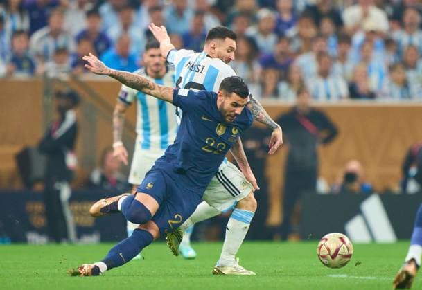Lionel MESSI, Argentina 10 compete for the ball, tackling, duel, header, zweikampf, action, fight against Theo Hernandez, FRA 22 in the WC Final match ARGENTINA - FRANCE 3-3 (7-5 after penalty shoot out) FIFA World Cup, WM, Weltmeisterschaft, Fussball 2022 QATAR Season 2022 2023, Dec 18, 2022 in Lusail Stadium in Doha, Qatar.