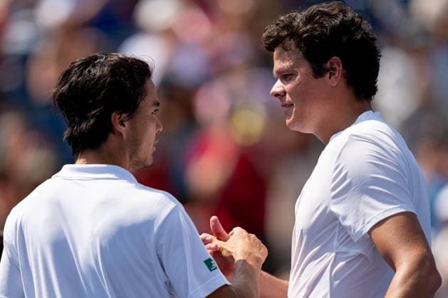 TORONTO, ON - AUGUST 09: Milos Raonic of Canada shakes hands with Taro Daniel of Japan after their second round match of the National Bank Open, part of the Hologic ATP, Tennis Herren Tour, at Sobeys Stadium on August 9, 2023 in Toronto, Canada. (Photo by Julian Avram Icon Sportswire) TENNIS: AUG 09 National Bank Open EDITORIAL USE ONLY Icon2308090089