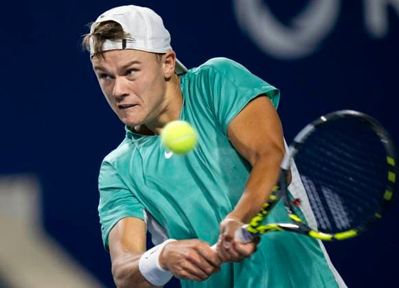 (230810) -- TORONTO, Aug. 10, 2023 -- Holger Rune of Denmark competes during the men s singles round of 32 match between Marcos Giron of the United States and Holger Rune of Denmark at the National Bank Open tennis tournament in Toronto, Canada, on Aug. 9, 2023. (Photo by Xinhua) (SP)CANADA-TORONTO-TENNIS-NATIONAL BANK OPEN-MEN S SINGLES ZouxZheng 