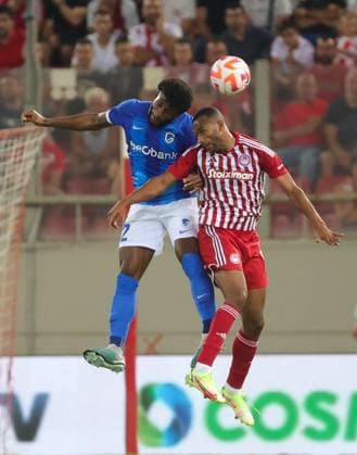 Genk s Mark McKenzie and Olympiacos Youssef El-Arabi fight for the ball during a soccer game between Greek Olympiacos F.C. and Belgian KRC Genk, Thursday 10 August 2023 in Piraeus, Greece, the first leg of the third qualifying round for the UEFA Europa League competition. VIRGINIExLEFOUR  x71874721x