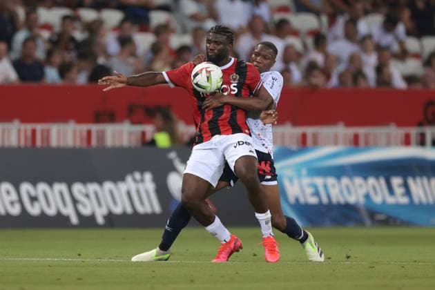 Nice, France, 11th August 2023. Bafode Diakite of LOSC LILLE tussles with Terem Moffi of OGC Nice during the Ligue 1 match at Allianz Riviera Stadium, Nice. Picture credit should read: Jonathan Moscrop Sportimage EDITORIAL USE ONLY. No use with unauthorised audio, video, data, fixture lists, club league logos or live services. Online in-match use limited to 120 images, no video emulation. No use in betting, games or single club league player publications. SPI-2504-0001