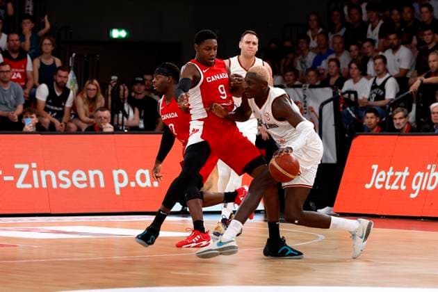 13.08.2023, Deutscher Basketball Bund, Supercup 2023, Hamburg, edel-optics.de Arena, Finale, Deutschland - Kanada, Rj Barrett, (CAN, No9), Isaac Bonga (GER, No0) Hamburg edel-optics.de Arena Hamburg Germany