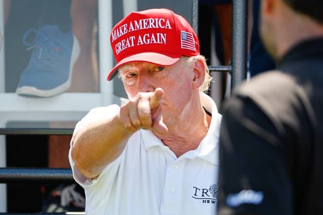 BEDMINSTER, NJ - AUGUST 13: Former President Donals J. Trump greets golfers at the first tee during the final round of LIV Golf Bedminster on August 13, 2023 at Trump National Golf Club in Bedminster, New Jersey. (Photo by Rich Graessle Icon Sportswire) GOLF: AUG 13 LIV Golf Bedminster EDITORIAL USE ONLY Icon23081422538