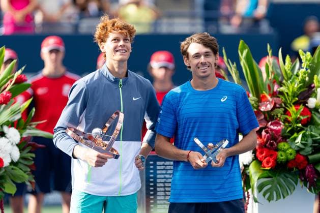 TORONTO, ON - AUGUST 13: Jannik Sinner of Italy and Alex de Minaur of Australia pose with their trophies after final game of the National Bank Open, part of the Hologic ATP, Tennis Herren Tour, at Sobeys Stadium on August 13, 2023 in Toronto, Canada. (Photo by Julian Avram Icon Sportswire) TENNIS: AUG 13 National Bank Open EDITORIAL USE ONLY Icon2308131463