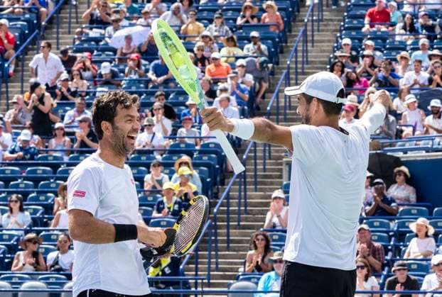 (230814) -- TORONTO, Aug. 14, 2023 -- Marcelo Arevalo (R) of Salvador and Jean-julien Rojer of the Netherlands celebrate victory after men s doubles final match between Rajeev Ram of the United States Joe Salisbury of Britain and Marcelo Arevalo of Salvador Jean-julien Rojer of the Netherlands at the 2023 National Bank Open in Toronto, Canada, on Aug. 13, 2023. (Photo by Xinhua) (SP)CANADA-TORONTO-TENNIS-NATIONAL BANK OPEN-MEN S DOUBLES FINAL ZouxZheng 