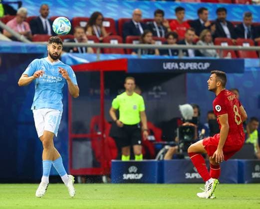Manchester City v Sevilla UEFA Super Cup Josko Gvardiol of Manchester City and Joan Jordán of Sevilla during the UEFA Super Cup match between Manchester City and Sevilla at Karaiskakis Stadium, Piraeus Copyright: xYannisxHalasx FIL-18759-0048 UK Newspapers OUT