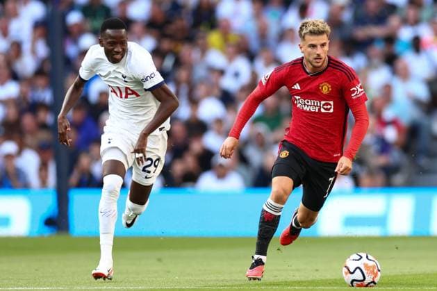 Mandatory Credit: Photo by Simon Dael Shutterstock (14056665ba) Mason Mount of Manchester United, ManU chased by Pape Matar Sarr of Tottenham Tottenham Hotspur v Manchester United, Premier League, Football, Tottenham Hotspur Stadium, London, UK - 19 Aug 2023 EDITORIAL USE ONLY No use with unauthorised audio, video, data, fixture lists, club league logos or live services. Online in-match use limited to 120 images, no video emulation. No use in betting, games or single club league player publications. Tottenham Hotspur v Manchester United, Premier League, Football, Tottenham Hotspur Stadium, London, UK - 19 Aug 2023 EDITORIAL USE ONLY No use with unauthorised audio, video, data, fixture lists, club league logos or live services. Online in-match use limited to 120 images, no video emulation. No use in betting, games or single club league player publications. Copyright: xSimonxDael Shutterstockx 14056665ba