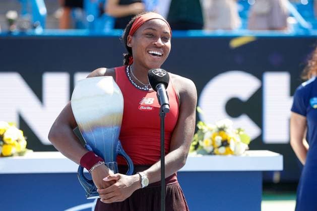 CINCINNATI, OH - AUGUST 20: Coco Gauff of the United States talks to the fans while holding the Rookwood Cup after defeating Karolina Muchova of the Czech Republic 6-3, 6-4. In the final round at the Western & Southern Open at Lindner Family Tennis Center on August 20, 2023 in Mason, Ohio. (Photo by Ian Johnson Icon Sportswire) TENNIS: AUG 20 Western & Southern Open EDITORIAL USE ONLY Icon230820022