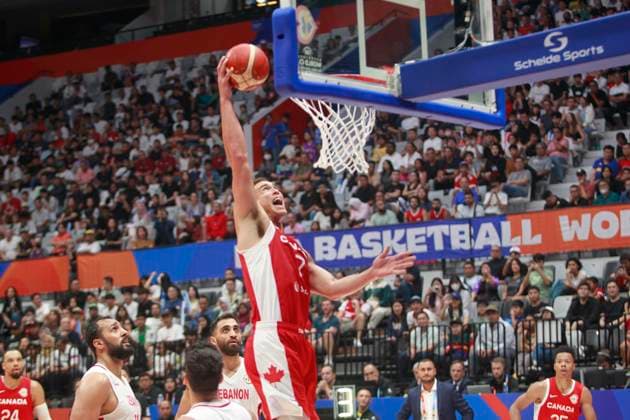 JAKARTA, INDONESIA AUGUST 27: Dwight Powell (R) of Canada dunk on Canada vs Lebanon game during 2023 FIBA Basketball World Cup in Jakarta, Indonesia on August 27, 2023. The 2023 FIBA Basketball World Cup will held on August 25 until September 10, 2023 in Jakarta - Indonesia, Manila - Philipines dan Okinawa Japan. BASKET BALL: Canada vs Liban - Jakarta - Coupe du Monde FIBA - 26 08 2023 YuliSeperi Panoramic 