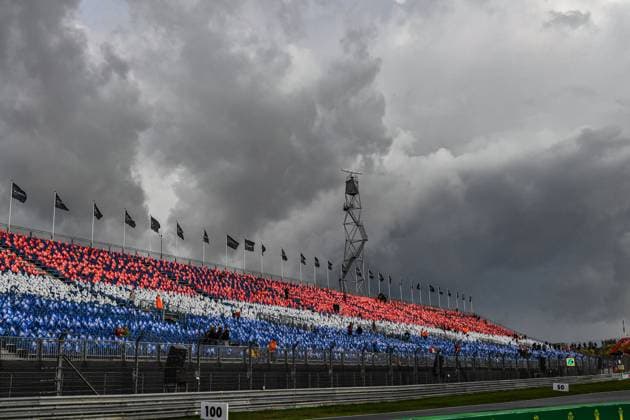 27th August 2023; Circuit Zandvoort, Zandvoort, North Holland, Netherlands; Formula 1 Heineken Dutch Grand Prix 2023; Race Day; Ominous dark clouds over the circuit and flags in the stands in the colours of the Dutch flag  ActionPlus12547641 GodfreyxPitt