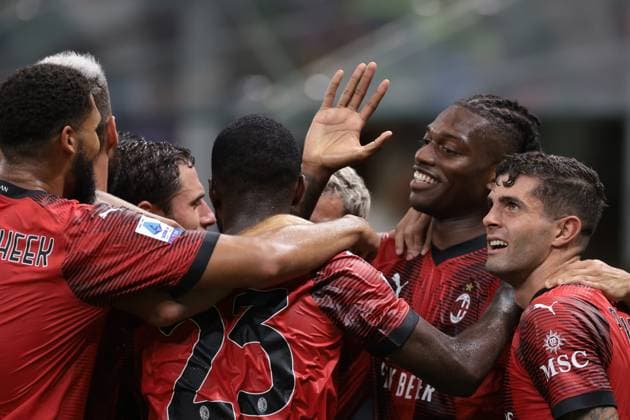 Milan, Italy, 26th August 2023. Theo Hernandez of AC Milan is mobbed by team mates after scoring to give the side a 3-1 lead during the Serie A match at Giuseppe Meazza, Milan. Picture credit should read: Jonathan Moscrop Sportimage EDITORIAL USE ONLY. No use with unauthorised audio, video, data, fixture lists, club league logos or live services. Online in-match use limited to 120 images, no video emulation. No use in betting, games or single club league player publications. SPI-2524-0178