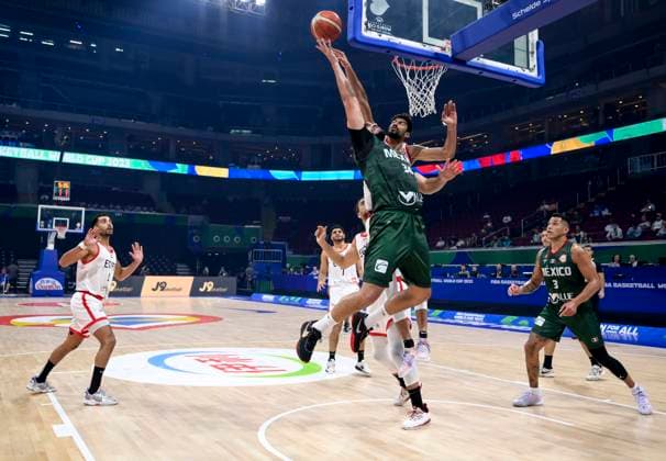 (230829) -- MANILA, Aug. 29, 2023 -- Mexico s Joshua Ibarra (top, front) is tackled during the Group D match between Egypt and Mexico at the 2023 FIBA World Cup in Manila, the Philippines, Aug. 29, 2023. ) (SP)PHILIPPINES-MANILA-BASKETBALL-FIBA WORLD CUP-GROUP D-EGY VS MEX HexChangshan 