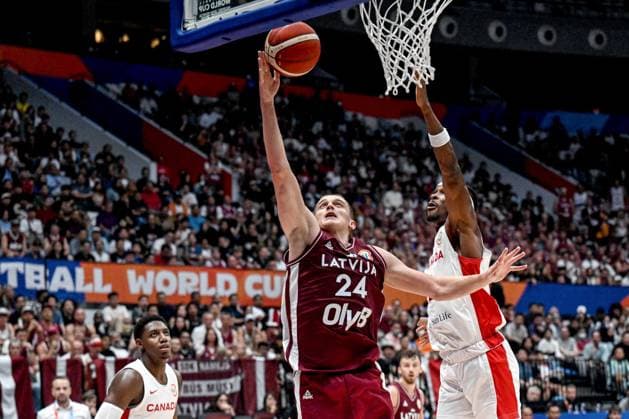(230830) -- JAKARTA, Aug. 30, 2023 -- Andrejs Grazulis of Latvia goes for a lay-up during the FIBA World Cup 2023 Group H match between Canada and Latvia in Jakarta, Indonesia, on Aug. 29, 2023. ) (SP)INDONESIA-JAKARTA-FIBA BASKETBALL-WORLD CUP 2023-GROUP H-CAN VS LAT AgungxKuncahyaxB. 