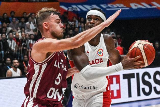 (230830) -- JAKARTA, Aug. 30, 2023 -- Shai Gilgeous-Alexander of Canada breaks through during the FIBA World Cup 2023 Group H match between Canada and Latvia in Jakarta, Indonesia, on Aug. 29, 2023. ) (SP)INDONESIA-JAKARTA-FIBA BASKETBALL-WORLD CUP 2023-GROUP H-CAN VS LAT AgungxKuncahyaxB. 