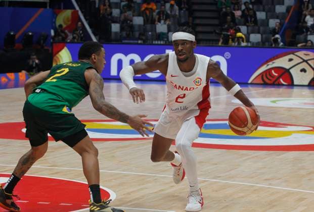 JAKARTA, INDONESIA SEPTEMBER 1: Canada™s Shai Gilgeous-Alexander (L) dribbling a ball on Canada vs Brazil game during 2023 FIBA Basketball World Cup in Jakarta, Indonesia on September 1, 2023. The 2023 FIBA Basketball World Cup held on August 25 until September 10, 2023 in Jakarta - Indonesia, Manila - Philipines dan Okinawa Japan. BASKET BALL : Canada vs Bresil - FIBA Coupe du monde - Jakarta - 01 09 2023 YuliSeperi Panoramic 