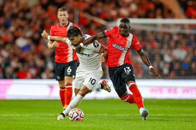 Luton Town v West Ham United Premier League 01 09 2023. Marvelous Nakamba (13) of Luton Town tussles with Lucas Paqueta (10) of West Ham United during the Premier League match between Luton Town and West Ham United at Kenilworth Road, Luton, England on 1 September 2023. Editorial use only DataCo restrictions apply See www.football-dataco.com , Copyright: xNigelxKeenex PSI-17963-0035