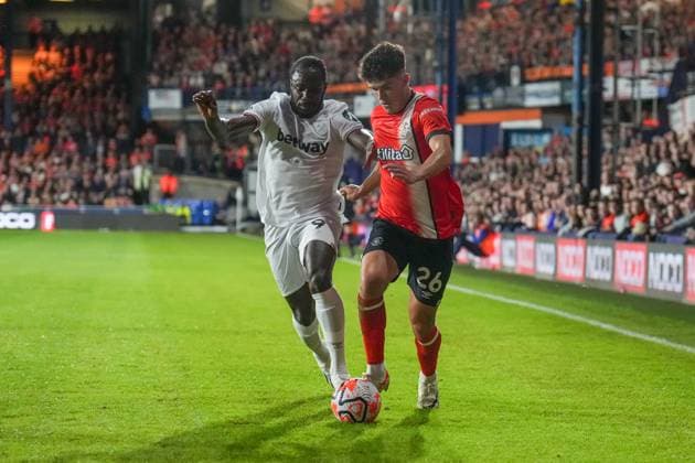 Michail Antonio (9) of West Ham United and Ryan Giles (26) of Luton Town during the Premier League match between Luton Town and West Ham United at Kenilworth Road, Luton, England on 1 September 2023. Copyright: xDavidxHornx PMI-5742-0085