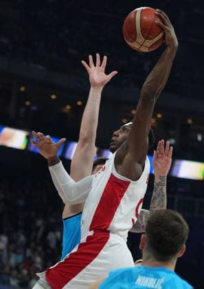 (230906) -- MANILA, Sept. 6, 2023 -- Canada s RJ Barrett dunks during the quarterfinal between Canada and Slovenia at the 2023 FIBA World Cup in Manila, the Philippines, Sept. 6, 2023. ) (SP)PHILIPPINES-MANILA-BASKETBALL-FIBA WORLD CUP-QUARTERFINAL-CAN VS SLO MengxYongmin 