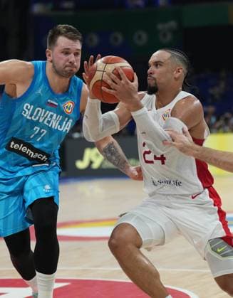 (230906) -- MANILA, Sept. 6, 2023 -- Canada s Dillon Brooks (R) breaks through during the quarterfinal between Canada and Slovenia at the 2023 FIBA World Cup in Manila, the Philippines, Sept. 6, 2023. ) (SP)PHILIPPINES-MANILA-BASKETBALL-FIBA WORLD CUP-QUARTERFINAL-CAN VS SLO MengxYongmin 