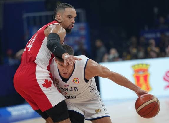 (230908) -- MANILA, Sept. 8, 2023 -- Serbia s Bogdan Bogdanovic (R) competes during the semifinal between Serbia and Canada at the 2023 FIBA World Cup in Manila, the Philippines, Sept. 8, 2023. ) (SP)PHILIPPINES-MANILA-BASKETBALL-FIBA WORLD CUP-SEMIFINAL-SRB VS CAN MengxYongmin 