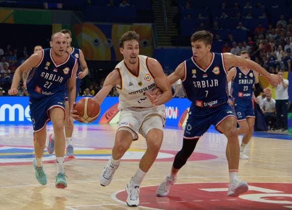 September 10, 2023, Manila, Philippines: FIBA World Cup Basketball Final Serbia vs Germany at the Mall of Asia Arena Manila Philippines.GermanyÃ¢â‚¬â ¢s Franz WAGNER (m) fends of SerbiaÃ¢â‚¬â ¢s Dejan DAVIDOVAC (l) and Bogdan BIGDANOVIC Manila Philippines - ZUMAr144 20230910_zap_r144_022 Copyright: xJaynexRussellx