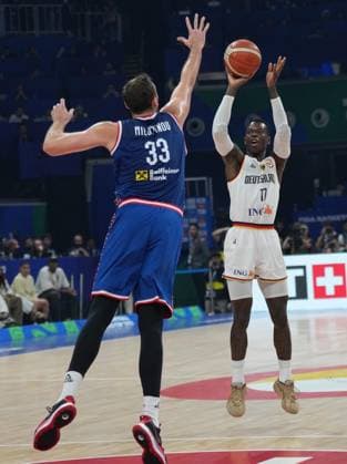 (230910) -- MANILA, Sept. 10, 2023 -- Dennis Schroder (R) of Germany shoots during the final between Germany and Serbia at the 2023 FIBA World Cup in Manila, the Philippines, Sept. 10, 2023. ) (SP)PHILIPPINES-MANILA-BASKETBALL-FIBA WORLD CUP-FINAL-GER VS SRB MengxYongmin 