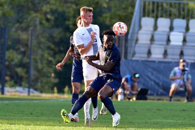 Arnaud Kalimuendo of France (R) in action against Mark Strajnar of Slovenia (L) during the 2025 UEFA European Under-21 Championship Qualification football match Group H between Slovenia and France FOOTBALL : SlovÃ nie vs France - Championnat d Europe des moins de 21 ans UEFA - Match de qualification Groupe H - 11 09 2023 IgorKupljenik Panoramic 