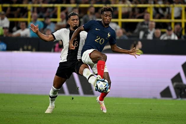 12.09.2023, xjhx, Fussball Länderspiel, Deutschland - Frankreich emspor, v.l. Benjamin Henrichs (Deutsche Fussball Nationalmannschaft DFB) Kingsley Coman (Frankreich) Zweikampf, Aktion, action, battle for the ball (DFL DFB REGULATIONS PROHIBIT ANY USE OF PHOTOGRAPHS as IMAGE SEQUENCES and or QUASI-VIDEO) Dortmund