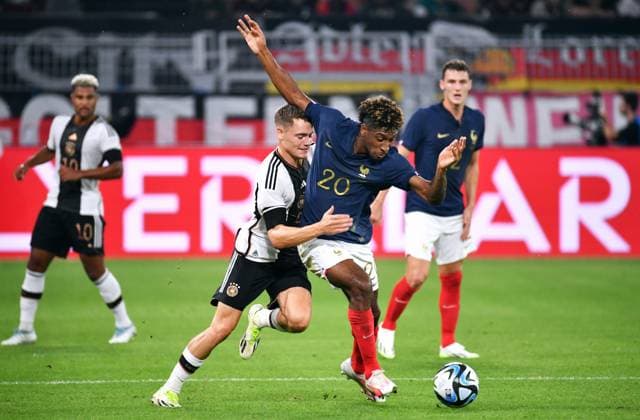 Fussball, Herren, Deutschland, Nationalmannschaft, Länderspiel, Signal Iduna Park Dortmund: Deutschland - Frankreich; Florian Wirtz (GER), Kingsley Coman (FRA). Aktion DFB REGULATIONS PROHIBIT ANY USE OF PHOTOGRAPHS AS IMAGE SEQUENCES AND OR QUASI-VIDEO.