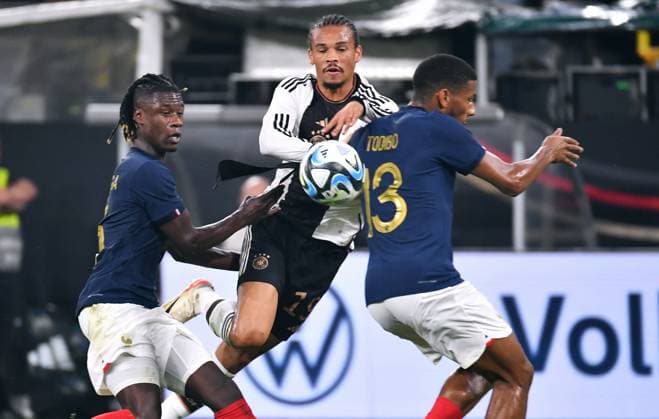 Fussball, Herren, Deutschland, Nationalmannschaft, Länderspiel, Signal Iduna Park Dortmund: Deutschland - Frankreich; Eduardo Camavinga (FRA), Leroy Sane (GER), Jean-Clair Todibo (FRA). Aktion DFB REGULATIONS PROHIBIT ANY USE OF PHOTOGRAPHS AS IMAGE SEQUENCES AND OR QUASI-VIDEO.