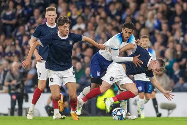 Scotland v England Friendly 150th Anniversary Match Jude Bellingham of England wrestles with Billy Gilmour of Scotland during the 150th Anniversary Heritage Match match between Scotland and England at The National Stadium, Hampden Park, Glasgow, 12 09 2023 Editorial use only , Copyright: xColinxPoultneyx PSI-17986-0063