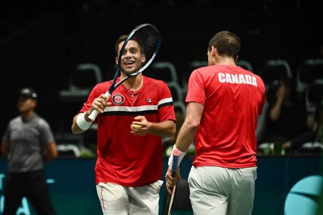 Foto Massimo Paolone LaPresse 13 Settembre 2023 - Bologna, Italia - tennis - Canada vs Italia - Alexis Galarneau Vasek Pospisil (CAN) v Simone Bolelli Matteo Arnaldi (ITA) - Coppa Davis 2023 - Unipol Arena. Nella foto: Alexis Galarneau, Vasek Pospisil, Frank Dancevic esultano September 13, 2023 Bologna, Italy - sport, tennis - Canada vs Italy - Alexis Galarneau Vasek Pospisil (CAN) v Simone Bolelli Matteo Arnaldi (ITA) - Davis Cup 2023 - Unipol Arena. In the pic: Alexis Galarneau, Vasek Pospisil, Frank Dancevic celebrate  Copyright: xMassimoxPaolone LaPressex