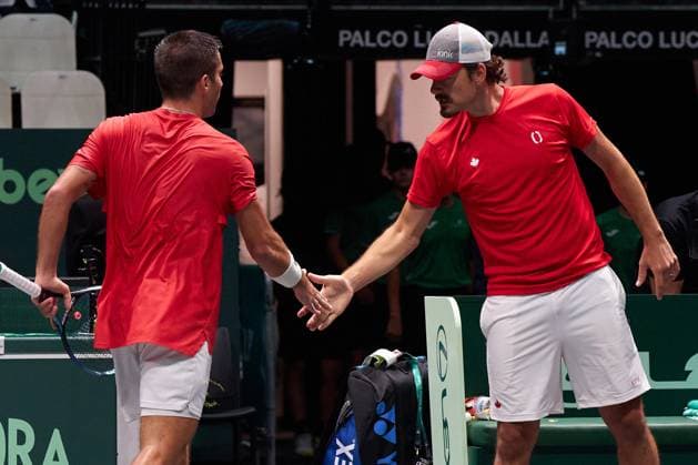 Tennis, Davis Cup, Kanada - Chile Captain Frank Dancevic and Alexis Galarneau of Canada celebrates winning first set against Alejandro Tabilo of Chile during the Davis Cup Group Stage 2023 Bologna match between Canada and Chile at Unipol Arena on September 16, 2023 in Bologna, Italy. (Photo by Camilla Stolen Imago) Bologna ITALY Copyright: xCamillaxStolenx L1420122