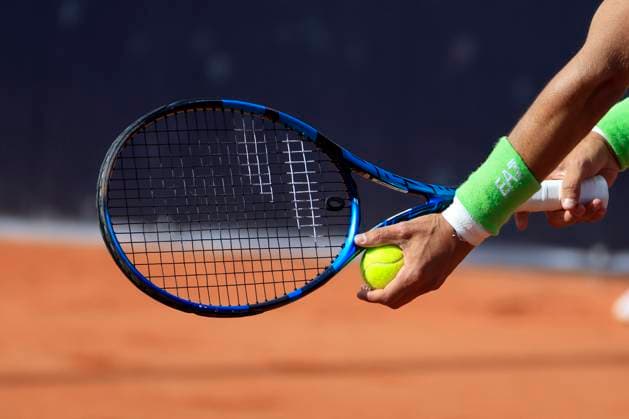TENNIS - ATP, Tennis Herren Layjet Open BAD WALTERSDORF,AUSTRIA,19.SEP.23 - TENNIS - ATP Challenger Tour, Layjet Open. Image shows a feature with a tennis racket, hands and a ball of Fabio Fognini (ITA).  GEPAxpictures xMarioxBuehner-Weinrauch