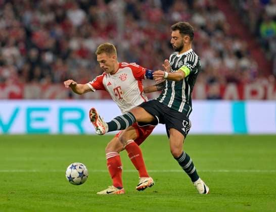 20.09.2023, Fussball UEFA Championsleague 2023 2024: 1.Spieltag Vorrunde, FC Bayern München - Manchester United, ManU in der Allianz-Arena München. v.l. Joshua Kimmich (FC Bayern München) gegen Bruno Fernandes (Manchester United)