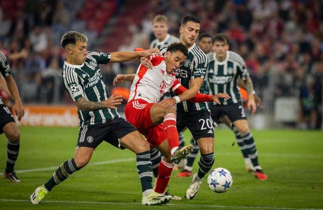 Munic, Germany. 20th Sep 2023. Jamal Musiala (Muenchen), Lisandro Martinez (ManU), Diego Dalot (ManU) FC Bayern München - Manchester United, ManU 20.09.2023