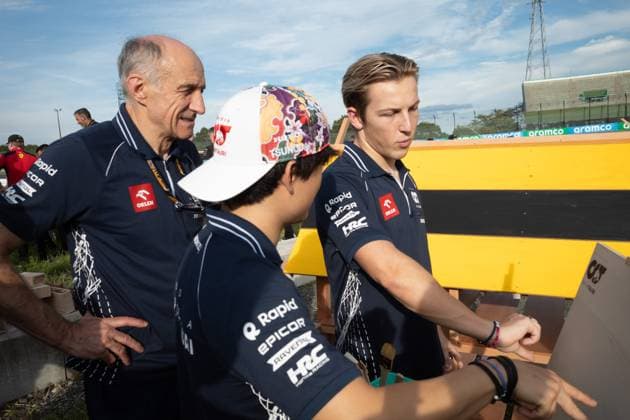September 21, 2023, Suzuka, Mie Prefecture, Japan: FRANZ TOST observes YUKI TSUNODA (JAP) of AlphaTauri 22 and LIAM LAWSON (NZL) of AlphaTauri 15 painting a bee hotel...A Buzzin Corner bee hive bee hotel constructed as an initiative by former F1 World Champion Sebastian Vettel during Preparation Day of the Formula 1 Lenovo Japanese Grand Prix. Vettel called a meeting of all the 20 starting grid drivers at Turn 2 to personalize the bee hotels and draw media attention to environmental conservation efforts. Suzuka Japan - ZUMAb177 20230921_aap_b177_081 Copyright: xTaidghxBarronx