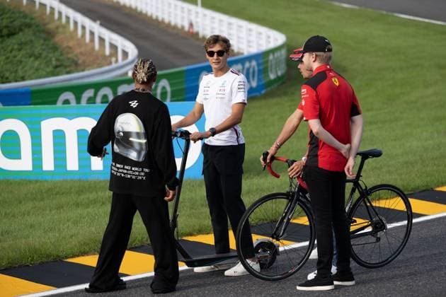 September 21, 2023, Suzuka, Mie Prefecture, Japan: LEWIS HAMILTON (GBR) of Mercedes 44, GEORGE RUSSELL (GBR) of Mercedes 63 and CHARLES LECLERC (MON) of Ferrari 16 arriving to a meeting called by Sebastian Vettel...A Buzzin Corner bee hive bee hotel constructed as an initiative by former F1 World Champion Sebastian Vettel during Preparation Day of the Formula 1 Lenovo Japanese Grand Prix. Vettel called a meeting of all the 20 starting grid drivers at Turn 2 to personalize the bee hotels and draw media attention to environmental conservation efforts. Suzuka Japan - ZUMAb177 20230921_aap_b177_084 Copyright: xTaidghxBarronx